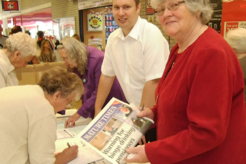 Janet Rowe, Michael Mullaney and Denise Wood collecting signatures 