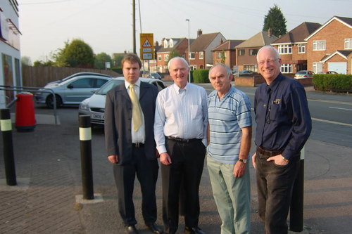 Lib Dem Councillors, David Bill, Dave Cope, Michael Mullaney and Don Wright at the front of the shop where the extra bollards are needed. 