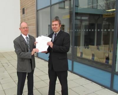 Cllrs Bill Crooks and Michael Mullaney submit the petition against plans to build 450 houses in Barlestone and Osbaston