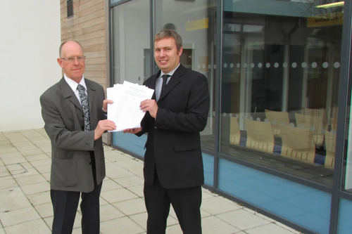 Cllrs Bill Crooks and Michael Mullaney submit the petition against plans to build 450 houses in Barlestone and Osbaston