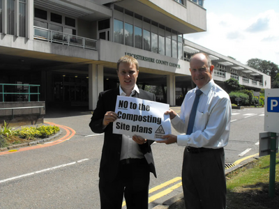 Cllrs Michael Mullaney and Bill Crooks protesting against the compost site plans outside Leicestershire County Council