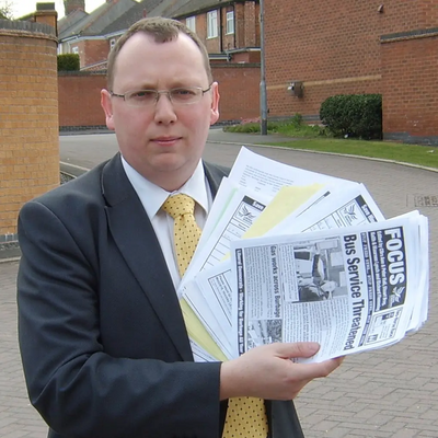 Cllr Stuart bray with some of the more than 2,000 signatures on the petition to save local bus services