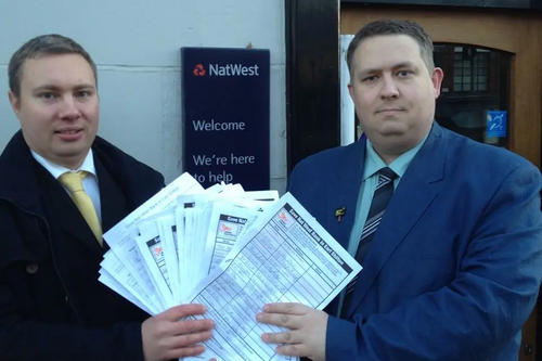 Cllrs Michael Mullaney and Mathew Hulbert with the petitions at Nat West Bank in Earl Shilton