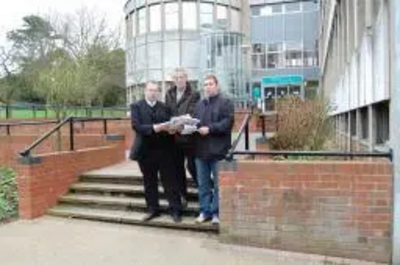 Burbage Liberal Democrat parish councillors Stuart Bray and Keith Lynch and Lib Dem parliamentary spokesman Michael Mullaney with the petitions against the phone mast