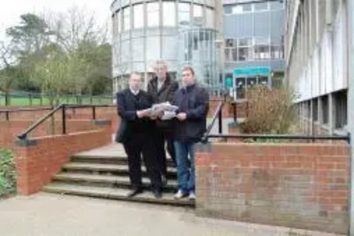 Burbage Liberal Democrat parish councillors Stuart Bray and Keith Lynch and Lib Dem parliamentary spokesman Michael Mullaney with the petitions against the phone mast