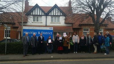 Councillors Michael Mullaney, David Bill and local residents outside Mount Road Hospital Hinckley